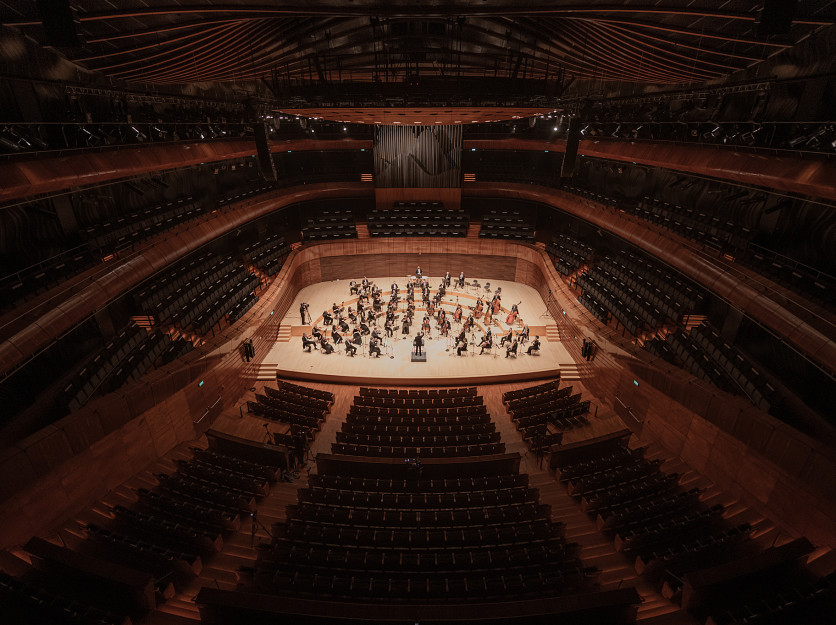 orchestra and conductor on stage at the NOSPR concert hall